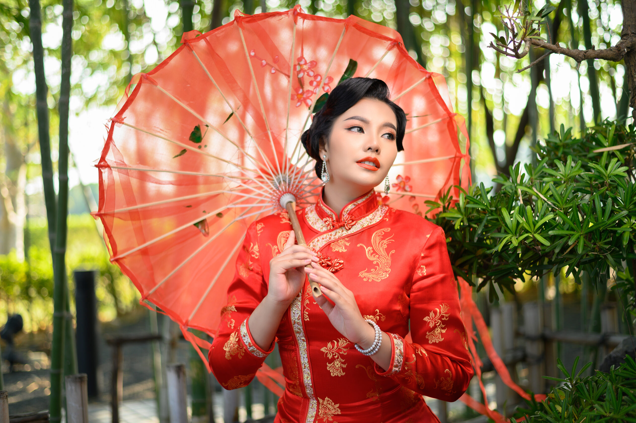 Asian pretty Chinese woman dress traditional cheongsam pose with